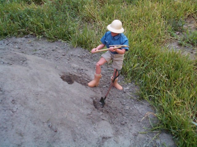 While I was digging into this mound, the head of Windsor Gardens Maintenance came by to check me out. Here I was, a suspicious adult with toys, and several Bankers' Boxes full of stuff, and a red tool box... these days, I may have been confronted by police instead. I told him what I was doing, and he left, happy. Weirded out, I'm sure, but happy.