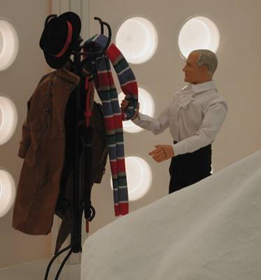 Hmmm, could it be cold in the control room? I had originally intended him to pick up his coat in the hallway, but that would be wrong. So I shot it this way. The main reason was I wanted him to be in his familiar long coat before he actually did anything. He should look like the Doctor before uncloaking the TARDIS console.